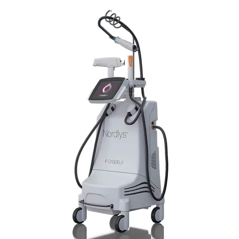 A medical device called Nordlys by Candela, featuring a control screen and various attached hoses and cables, mounted on wheels for mobility. Ideal for pigmentation reduction treatments.